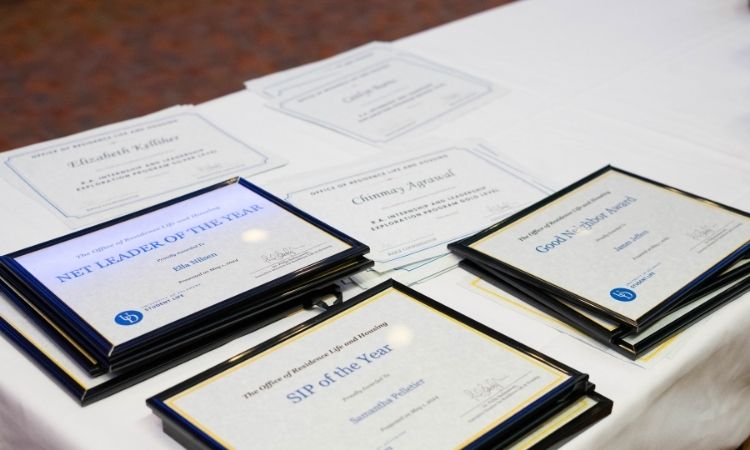 Award certificates displayed on the award table