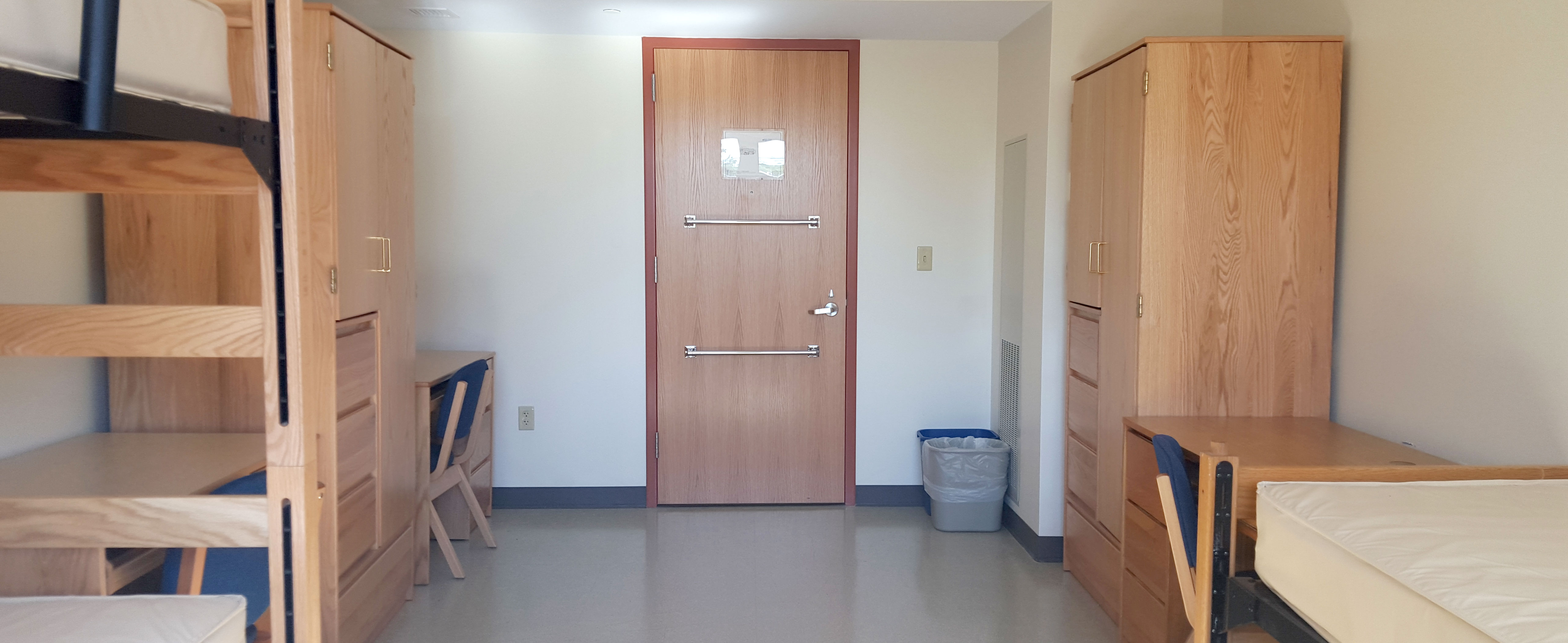 Interior of a room in Gilbert with two beds, two desks and two wardrobes