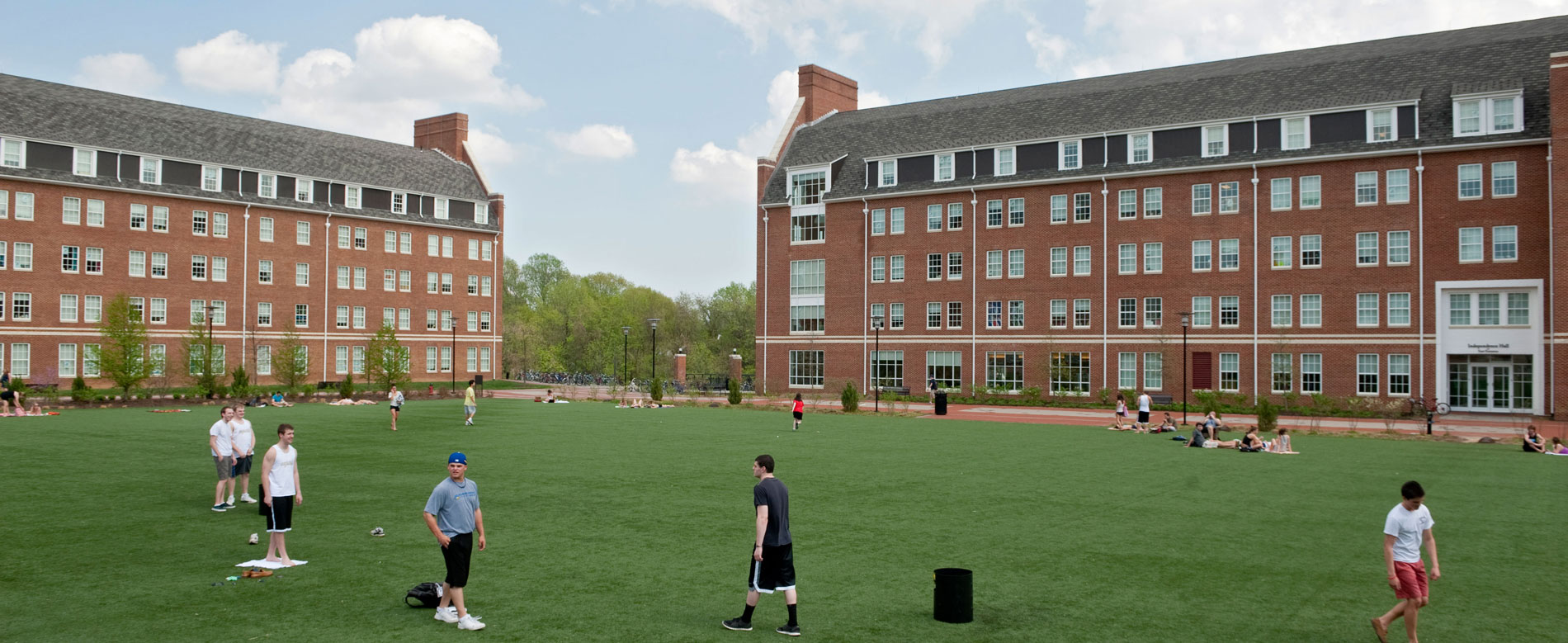 Students relaxing on the turf between Independence East and West