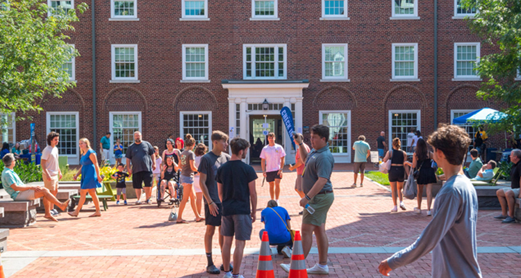 students walking in front of Squire Hall