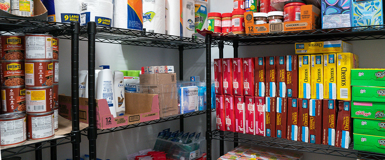 Stocked shelves of food items and toiletries