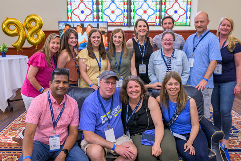 Members of the Class of 1998 reconnect during their 25th reunion in Daugherty Hall (formerly The Abbey). 