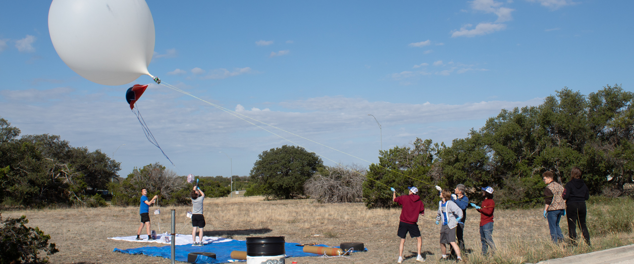 The Eclipse Chasers test their research balloon during an annular solar eclipse. Gusty winds made it tough to control the balloon and get it into position for launching.