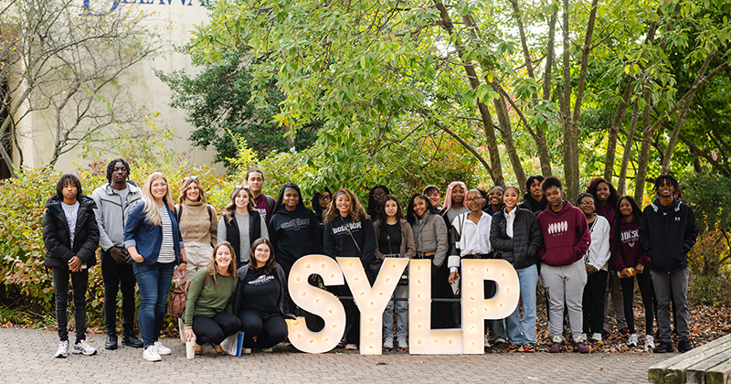 Local high school students pose outside of Clayton Hall during the Siegfried Youth Leadership Program event held in October.