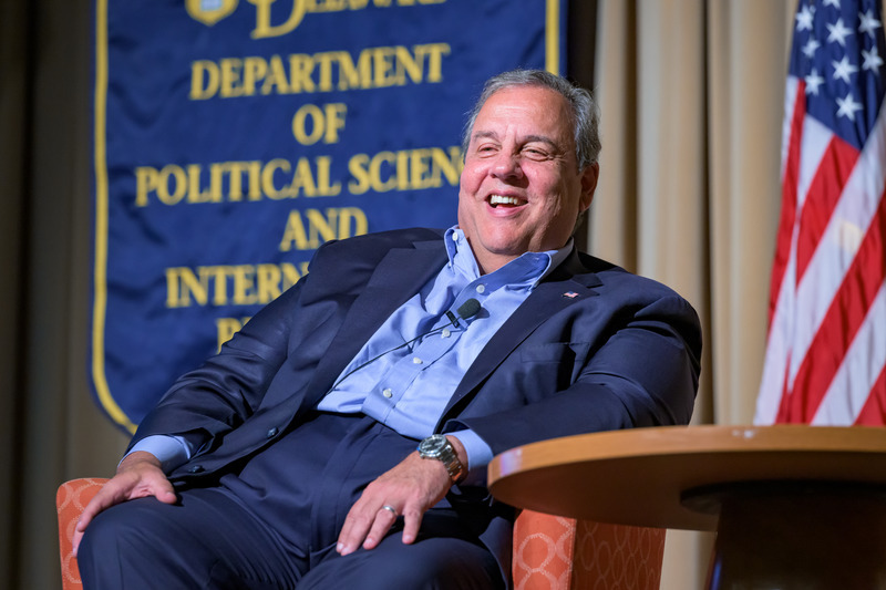 Chris Christie seated in a chair smiling