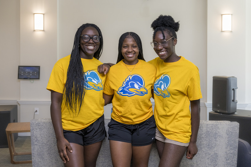 OCM - Welcome Days - Friday Move-In - SASR/Redding - 082324 Three students wearing gold UD t-shirts
