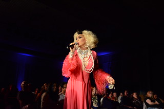 A performer sings during a Lavender Programming Board Drag Show