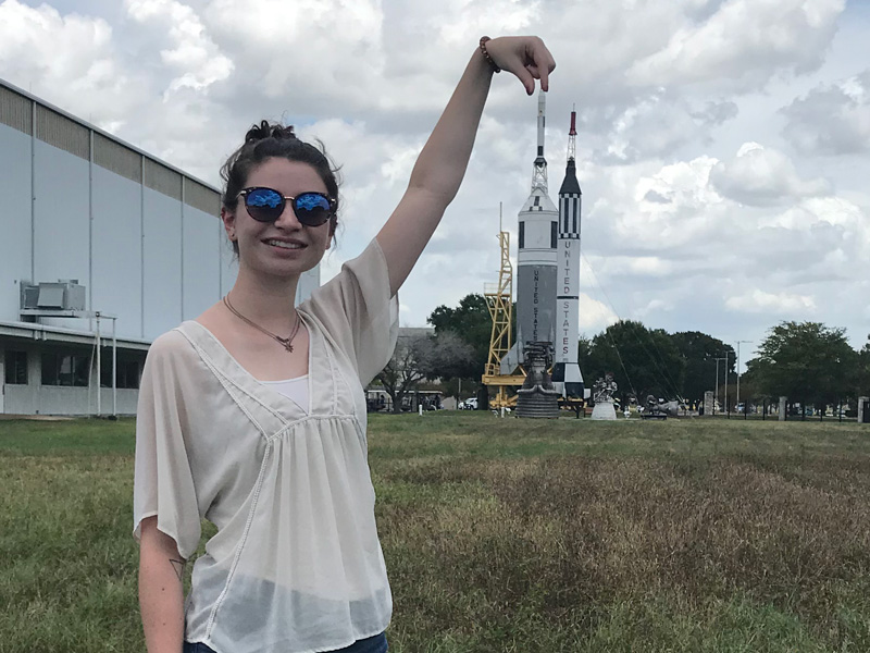 UD student Natalie Zimmerman with the Mercury-Redstone launch vehicle at Rocket Park at Johnson Space Center.