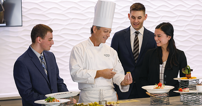 Students and faculty participate in experiential learning the in the new demo kitchen for Vita Nova.