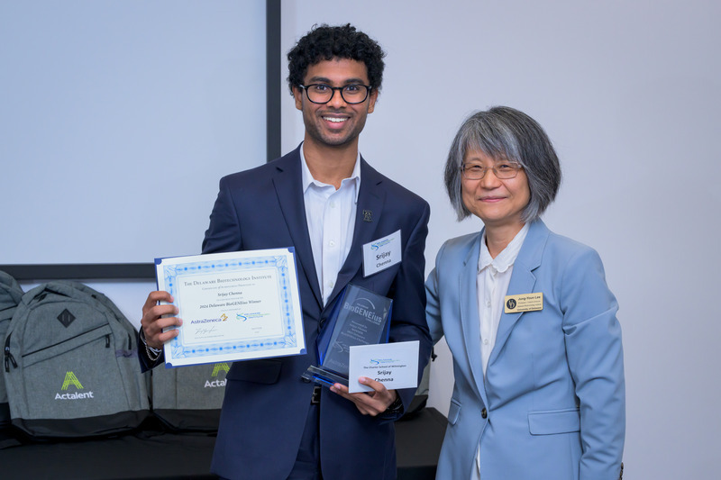 Srijay Chenna (left), from Charter School of Wilmington, received top honors at the 2024 Delaware BioGENEius Challenge for his research project focusing on improving the production process for mRNA medicines. He is congratulated by UD Professor Jung-Youn Lee, interim director of the Delaware Biotechnology Institute. Srijay Chenna (left), from Charter School of Wilmington, received top honors at the 2024 Delaware BioGENEius Challenge for his research project focusing on improving the production process for mRNA medicines. He is congratulated by UD Professor Jung-Youn Lee, interim director of the Delaware Biotechnology Institute.