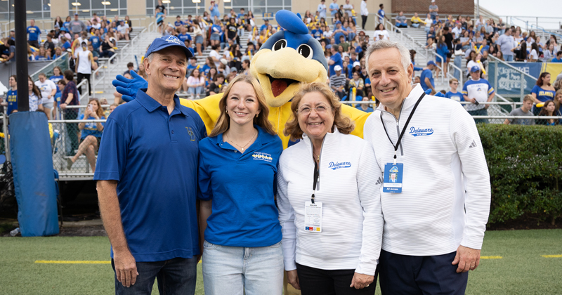 Kerri Oliver (second from left), a senior actuarial sciences major, is the 2024 T. Muncy Keith Spirit Award recipient. She is pictured with alumnus Bill Luzier, Eleni Assanis and UD President Dennis Assanis.