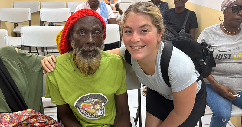 Shayna Fink (right), a senior medical diagnostics major with a pre-physician assistant concentration, poses with a Vision Health International patient after a successful cataract surgery in Grenada.