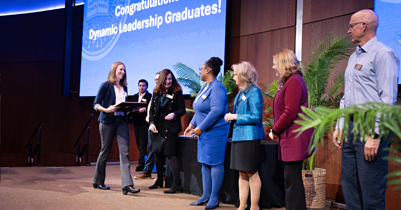 Students take the stage to receive their Dynamic Leadership certificates.