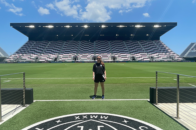 Mariah Bernanke, director of sports medicine for Chattanooga Football Club, who graduated with her Doctor of Physical Therapy from UD in 2024, poses inside Inter Miami Football Club’s Chase Stadium, where the team met for a regular season game.