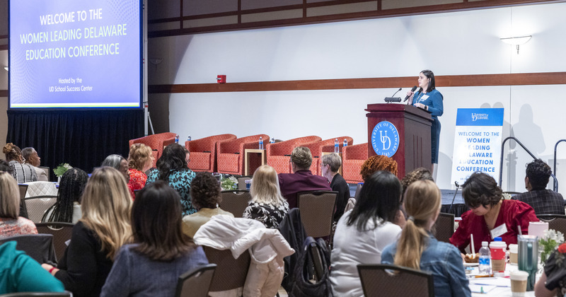 Alison Travers, assistant director of the Delaware Academy for School Leadership in CEHD’s School Success Center, welcomes participants to the 2024 Women Leading Delaware Education Conference. 