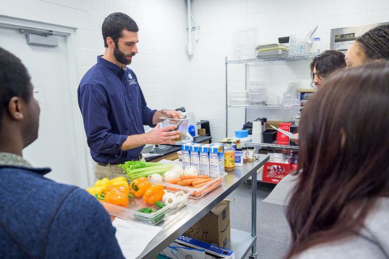 Michael Crossley talks to his students about how to prepare Sago worm and black bean chili. Michael Crossley talks to his students about how to prepare Sago worm and black bean chili.